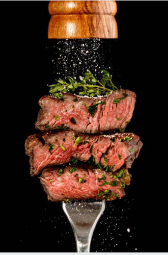 Sliced cooked steak with herbs and cracked pepper for the Carrell Farms Steak Lovers package
