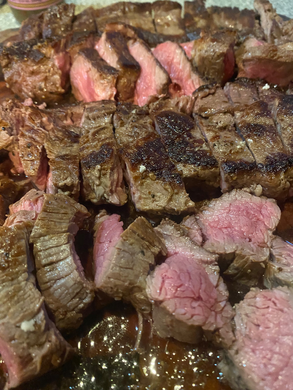 Sliced cooked Carrell Farms water buffalo flat iron steak