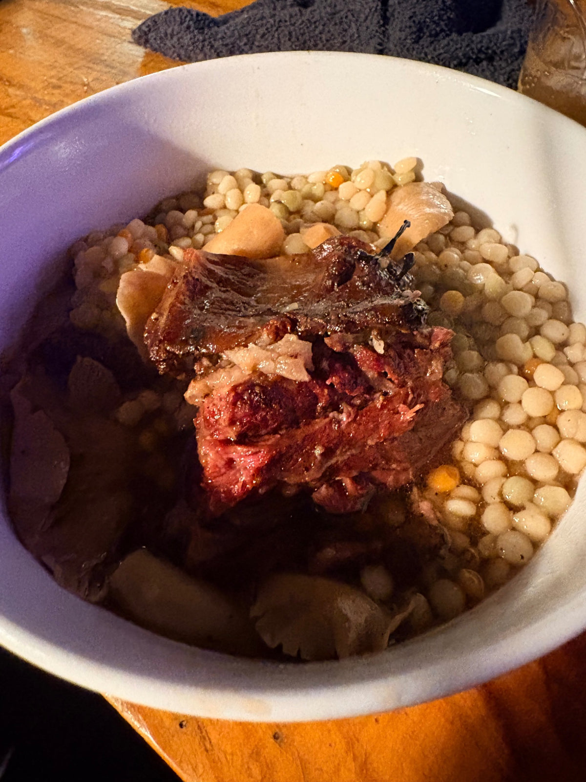 Cooked Carrell Farms water buffalo short ribs served with vegetables
