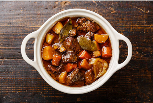 Carrell Farms water buffalo stew with potatoes, carrots, onions, and bay leaves