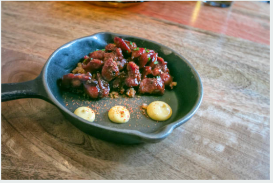 Cooked Carrell Farms water buffalo sweetbreads served in a skillet