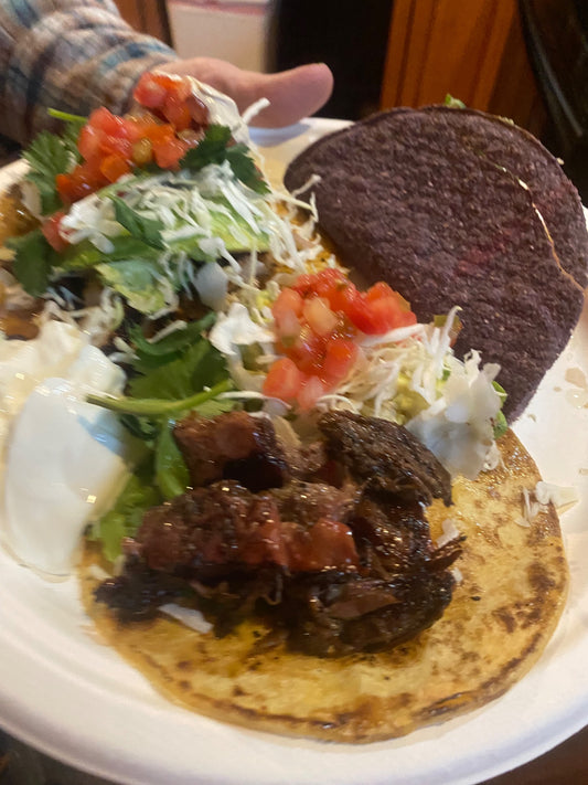 Carrell Farms water buffalo tongue tacos served with fresh toppings